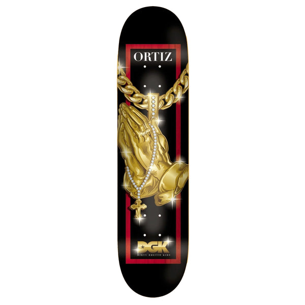 A black skateboard deck with praying hands on a gold chain.