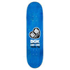 The DGK X Kaido House Konbini Holographic Multicolor skateboard deck features a blue base with black and white stylized graphics, showcasing DGK and Kaido House logos. It's 8.25" wide and has Zokusha Rainbow Glitter accents for added flair.