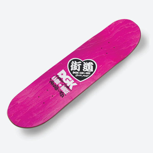 The DGK X KAIDO HOUSE ZOKUSHA RAINBOW GLITTER skateboard deck features pink with white and black designs, bold text, a circular logo, stylized graphics, and silver glitter sparkle for an enhanced ride.