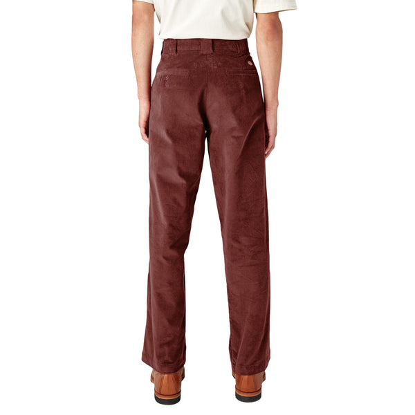 The back view of a man wearing DICKIES REGULAR FIT CORDUROY PANT FIRED BRICK by Dickies.