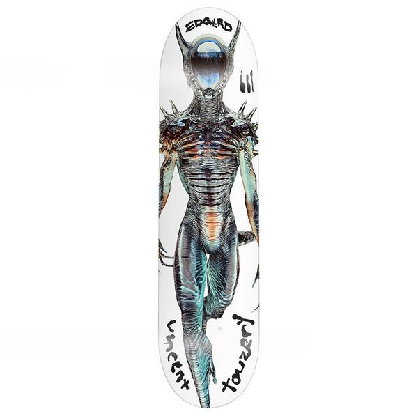 The EDGLRD VINCENT TOUZERY FLEXRX is a black 7-ply maple skateboard deck featuring a spiked humanoid alien illustration on white with black handwritten text at the top and bottom.