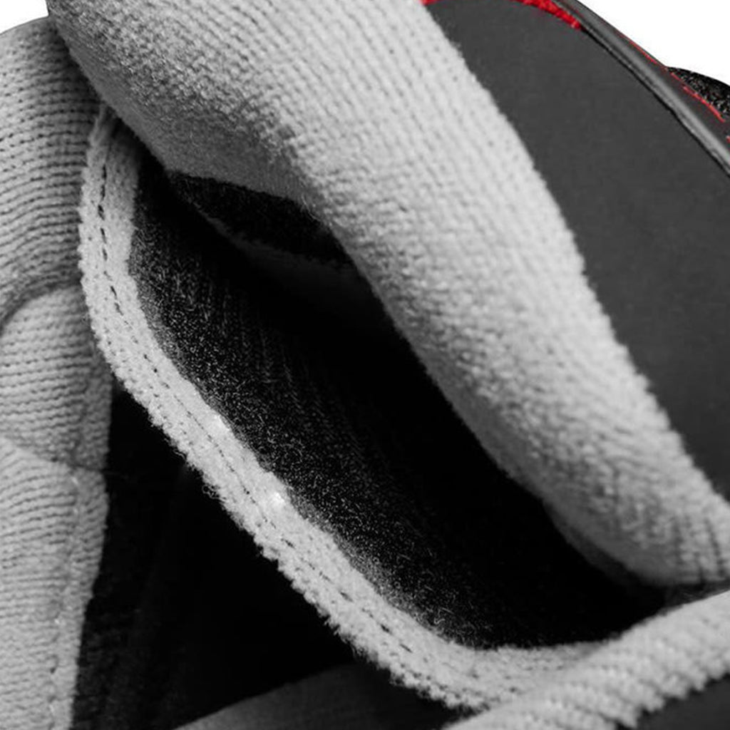 A close up of a pair of ÉS THE MUSKA BLACK / RED shoes.