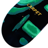 The skateboard deck features abstract Carpet Egypt Green and teal designs by Carpet Co. on a black background. The hand-screened gold "CARPET" at the top enhances its sleek style and precise wheelbase.