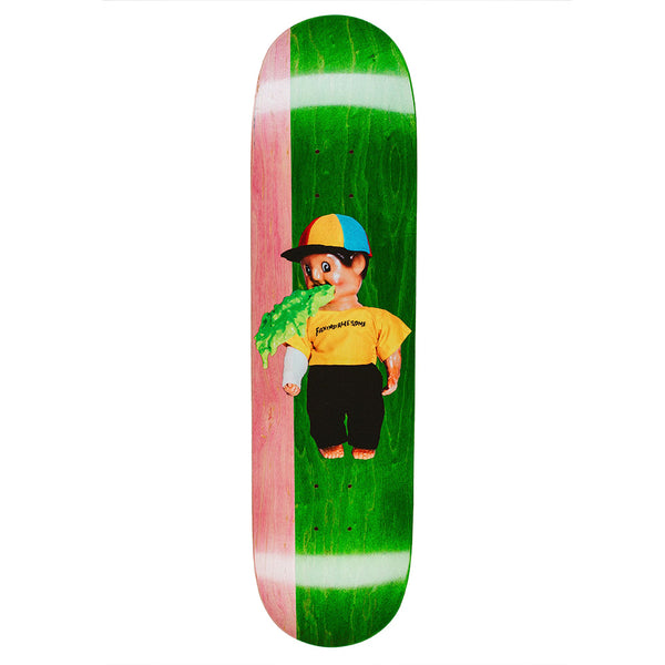 The FUCKING AWESOME WANTO THROW UP MAN skateboard deck by FUCKING AWESOME features a split pink and green design with an illustrated doll in a yellow shirt and cap, spewing green goo from its mouth.