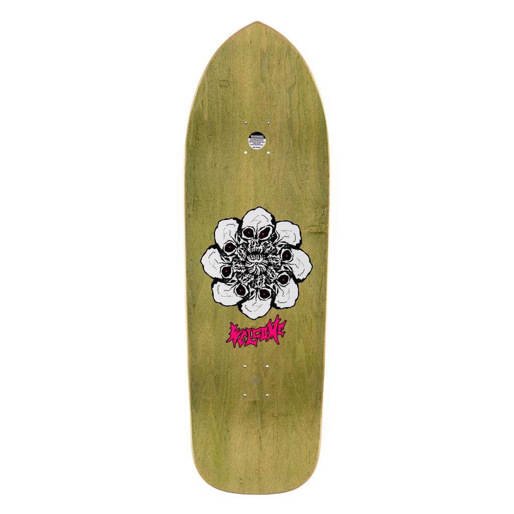 A WELCOME skateboard with a flower on it.