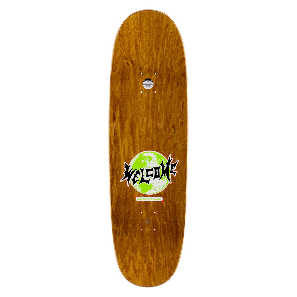A Welcome skateboard with a green logo on its wheelbase.