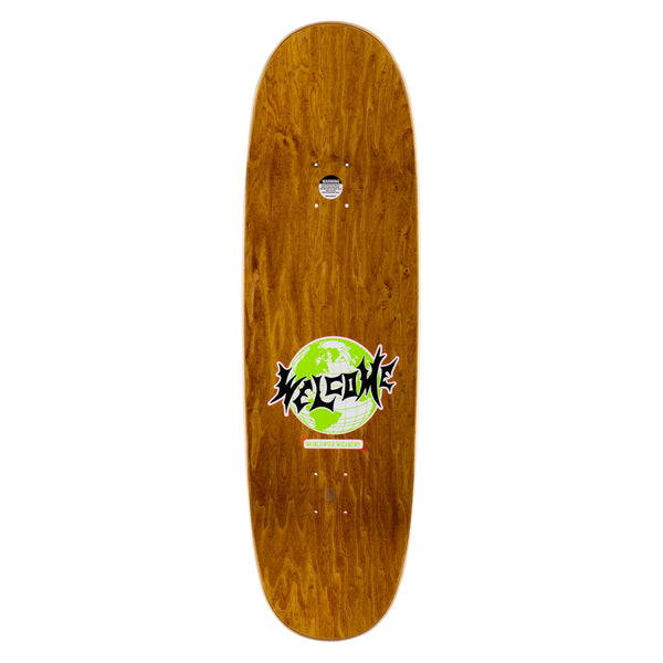 A Welcome skateboard with a green logo on its wheelbase.