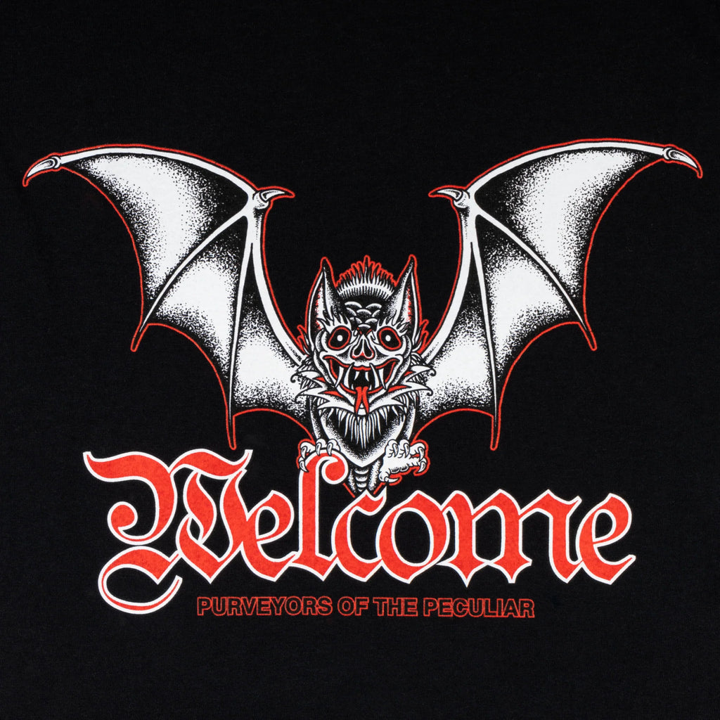 A black WELCOME t-shirt with a bat on it and the word NOCTURNAL.