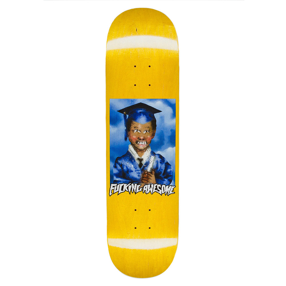 The FUCKING AWESOME X SICKID K.B. CLASS PHOTO skateboard deck features a smiling child in a blue graduation cap and gown, with "Fucking Awesome" printed below the portrait on a striking yellow background.