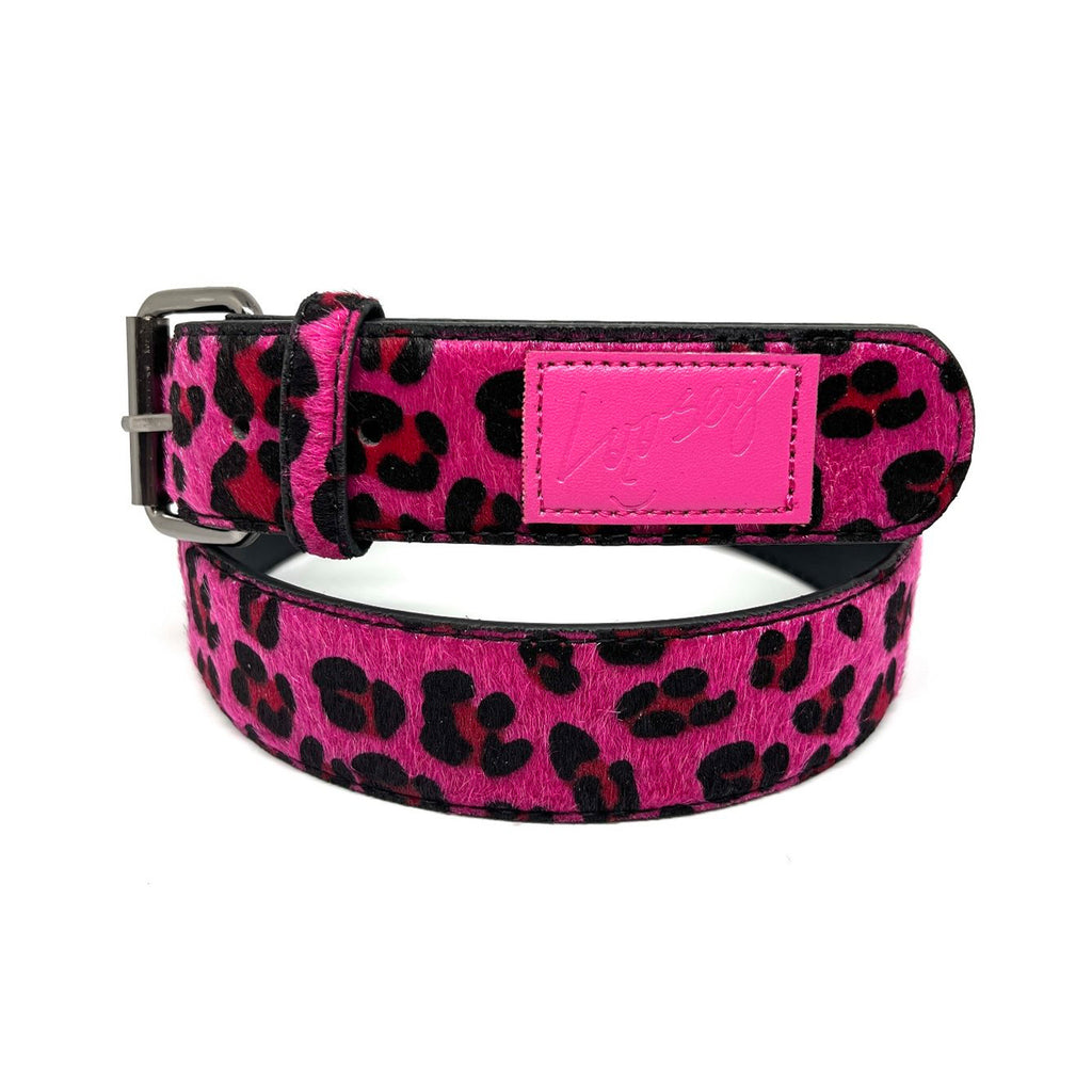 A Loosey pink cheetah print belt with a black buckle featuring gold detail.