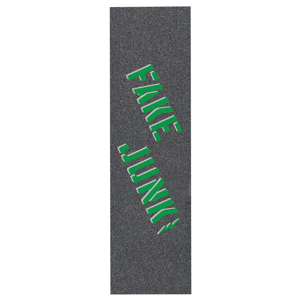 A black skateboard with FAKE JUNK griptape stencil in pine green on it.
