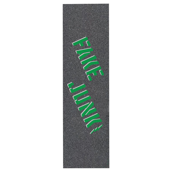 A black skateboard with FAKE JUNK griptape stencil in pine green on it.