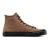 The CONVERSE CONS Roman Gonzales Chuck Taylor All Star Pro Hi, in Mushroom Forage/Black, is a brown high-top sneaker with a black sole and brown laces. Featuring a round logo on the ankle, it offers a Chuck Taylor-inspired design perfect for skateable adventures.