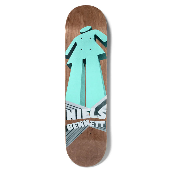 A brown stained skateboard deck with an image of a giant, teal colored, 3D girl logo and the name "Niels Bennett".
