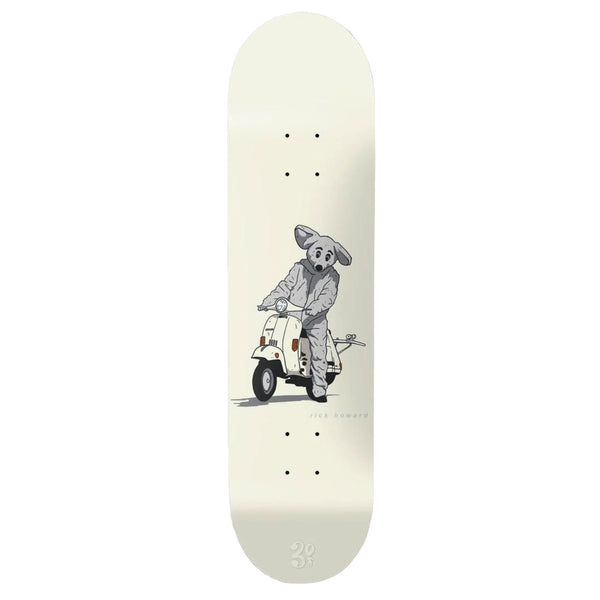 A GIRL skateboard with a drawing of a man riding a scooter.