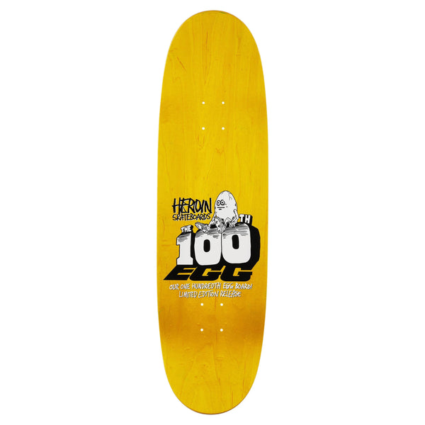 The HEROIN 100TH EGG is a yellow 9.125" skateboard deck made from North American Hard Rock Maple, featuring the "Heroin Skateboards" logo, a ghost graphic, and "The 100th Egg, Limited Edition Heritage.