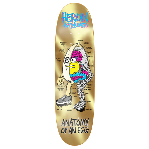 A HEROIN skateboard made of North American Hard Rock Maple with an image of a GOLD egg.