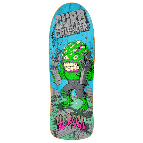 A skateboard with the Heroine Curb Crusher XL Barf by Baker, featuring a green monster and gold embellishments.