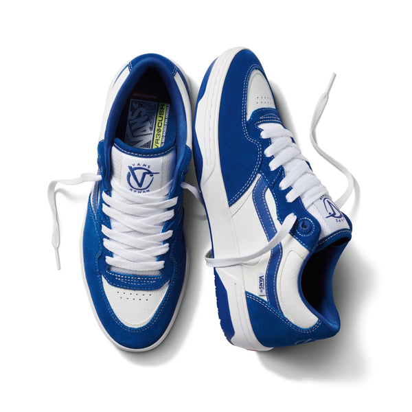 A pair of VANS ROWAN 2 TRUE BLUE sneakers on a white surface.