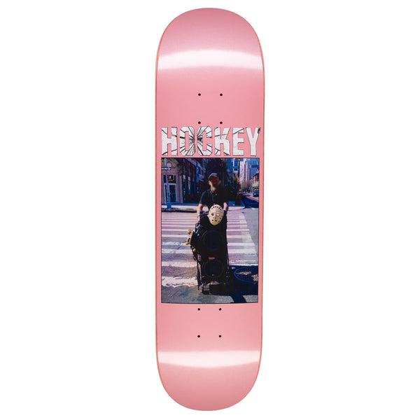 A pink HOCKEY skateboard with a digital print of a woman on it.
