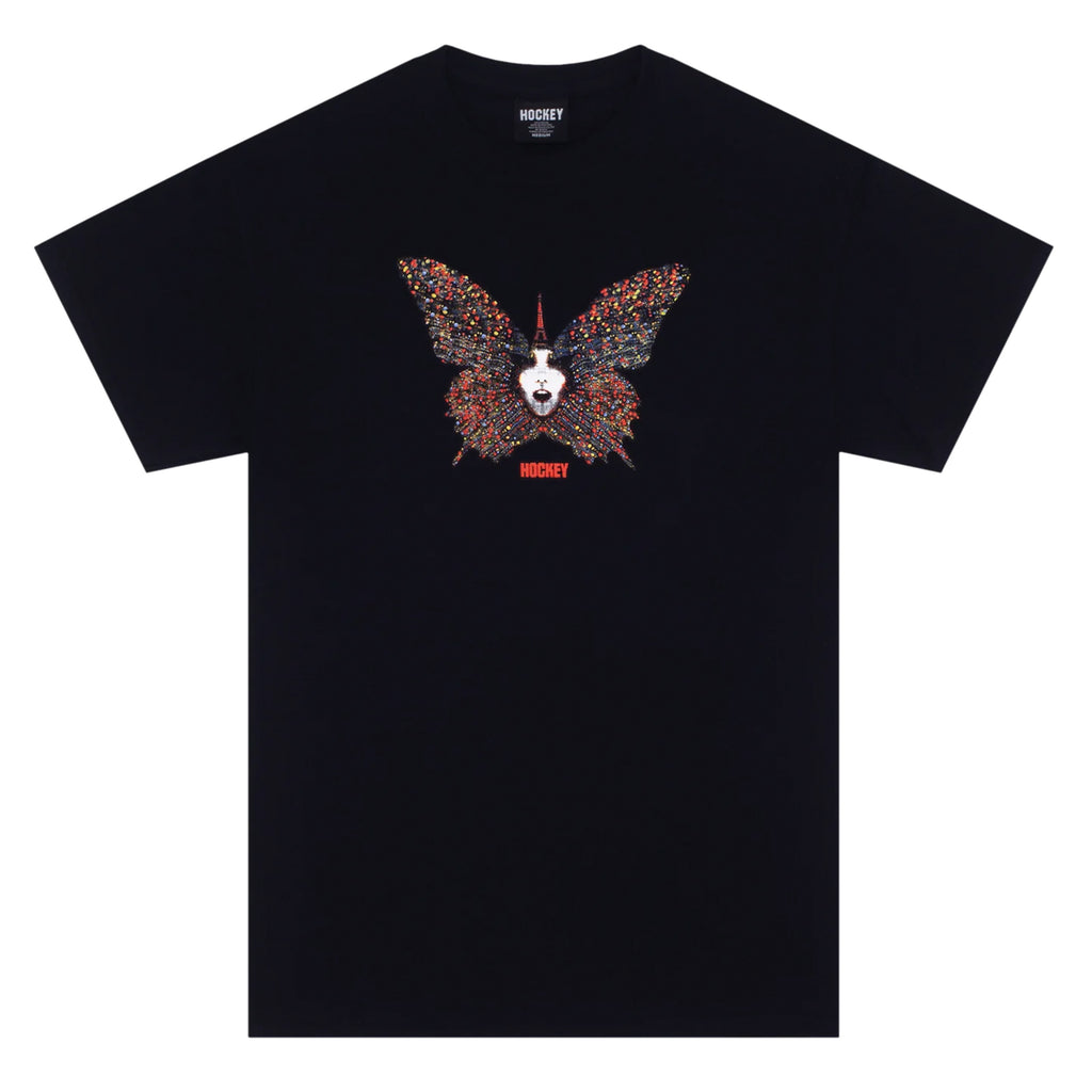 A black t-shirt with a butterfly design with a face in the middle on it.
