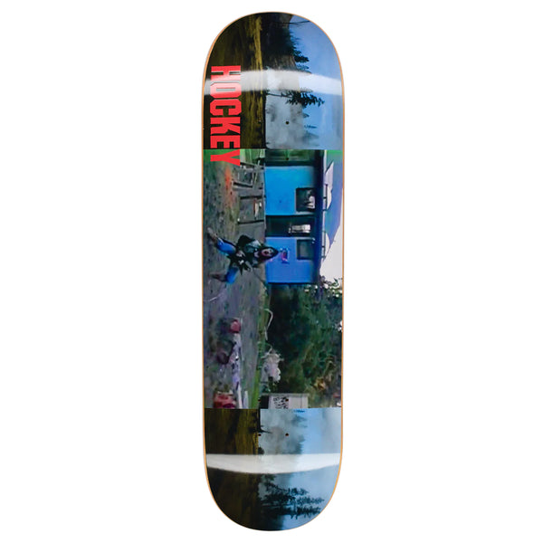 A HOCKEY skateboard deck with a picture of a man riding a skateboard.