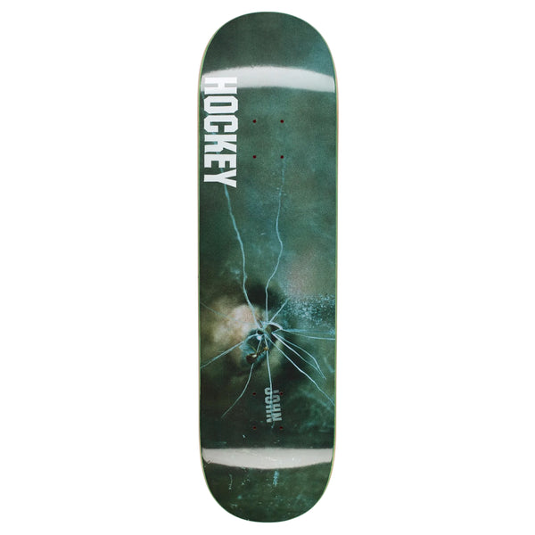 A HOCKEY skateboard with a raised logo and cracked surface.