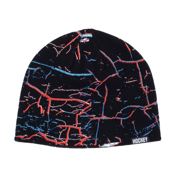 A black and blue HOCKEY NIKITA BEANIE with a red and blue pattern.