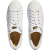 A pair of white adidas superstar ADV sneakers with gold detailing.