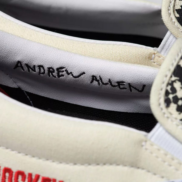 A pair of VANS sneakers with the word andrew allen written on them.