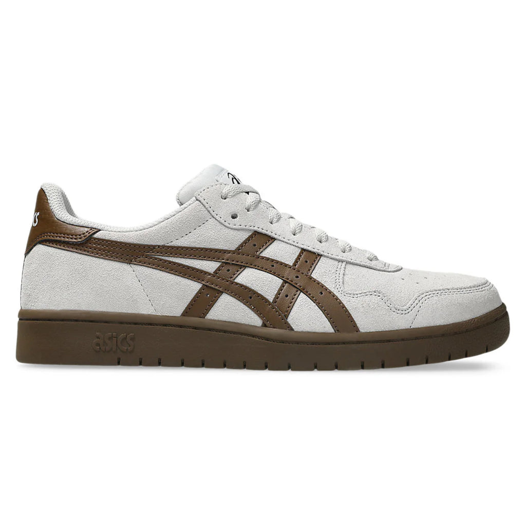 The ASICS JAPAN PRO in Cloud Grey/Brown Storm features white suede with brown leather accents, suede paneling, and a brown rubber sole, shown from the side.