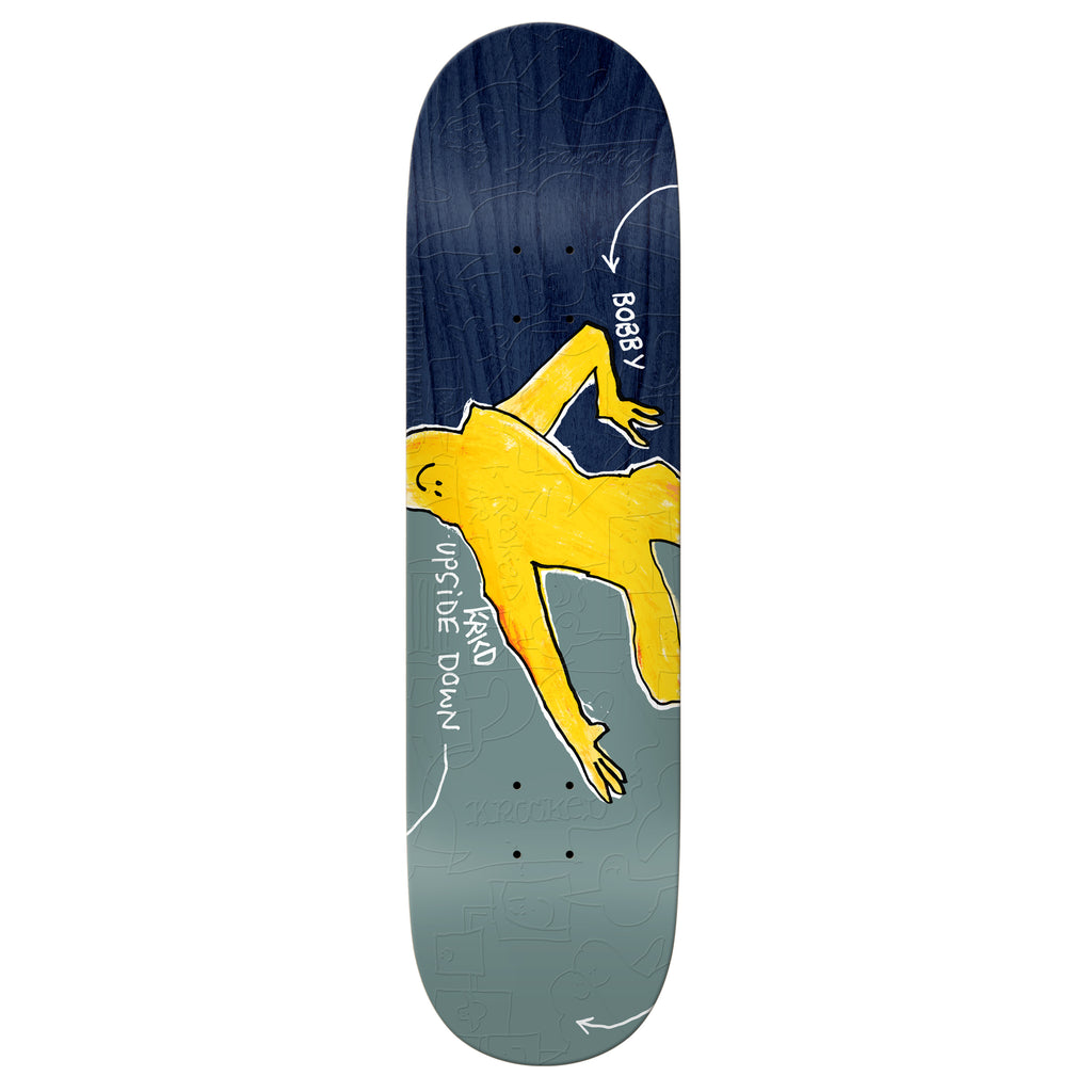 A DELUXE KROOKED WORREST UPSIDE DOWN skateboard deck featuring an 8.38" width and an image of a man riding a skateboard.