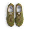 The top view of a suede and leather army green shoe with the last resort logo in the inside sole.
