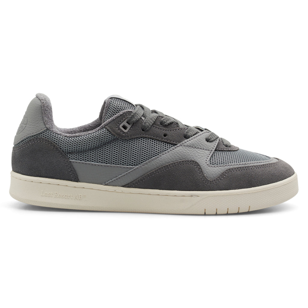 LAST RESORT AB CM002 ULTIMATE GREY by Last Resort AB: A gray sneaker combining suede and mesh textures, a white rubber sole, and delicate accents of tactile green.