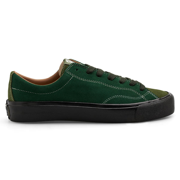 A pair of LAST RESORT AB VM003 LO SUEDE DUO GREEN / BLACK sneakers with black soles from Last Resort AB.