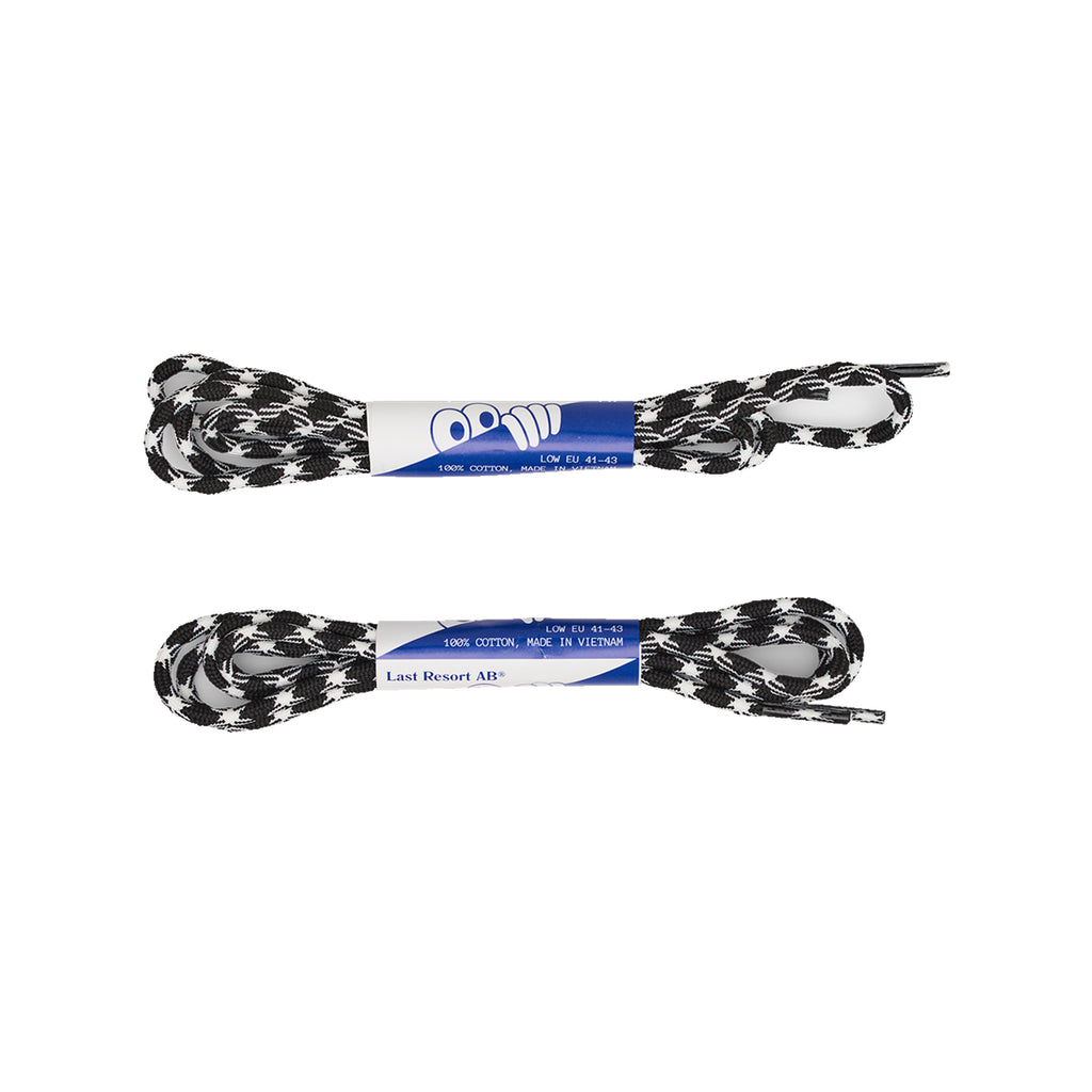 Two pairs of LAST RESORT AB CM002 BLACK / BLACK shoelaces, each tied with a blue and white paper band displaying "100% Cotton, Made in Vietnam." Ideal for enhancing the look of your black/white leather sneakers.