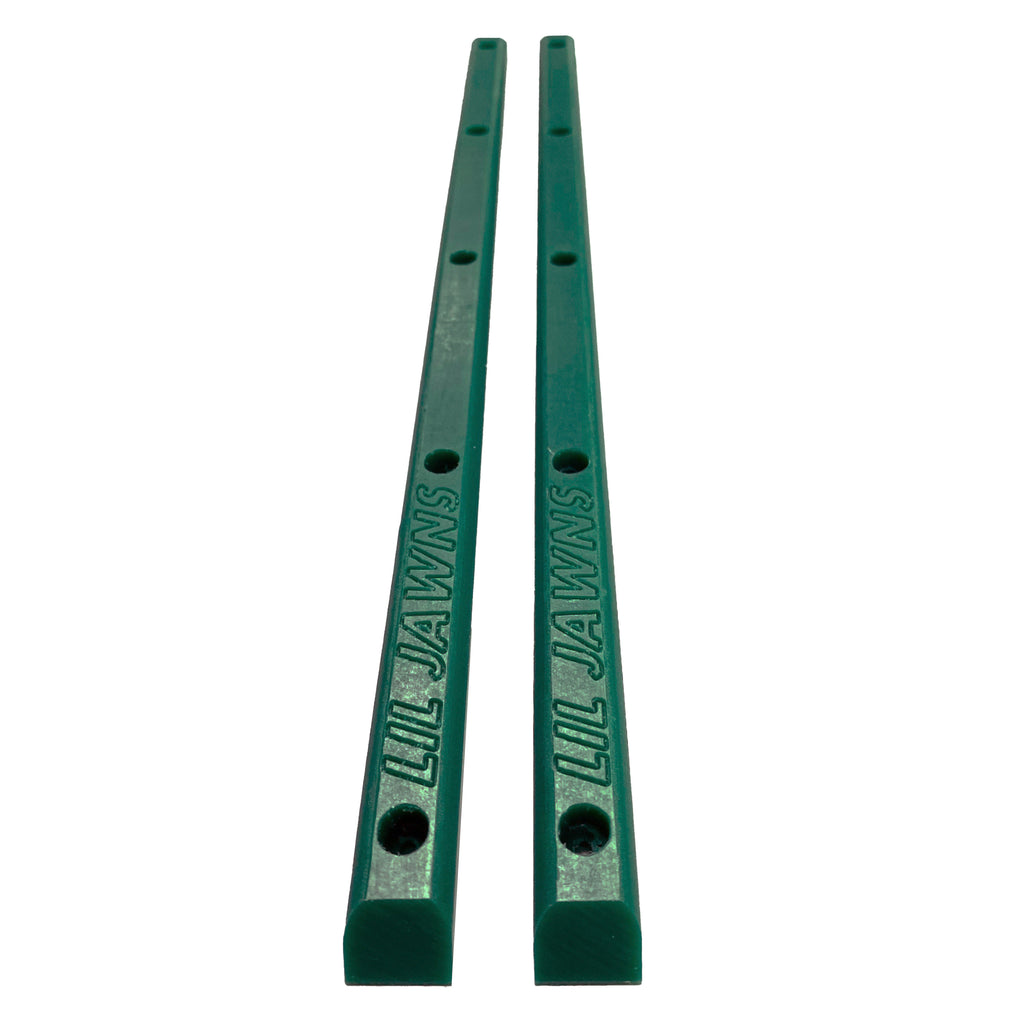 A pair of dark green plastic skateboard rails with 5 holes each. 