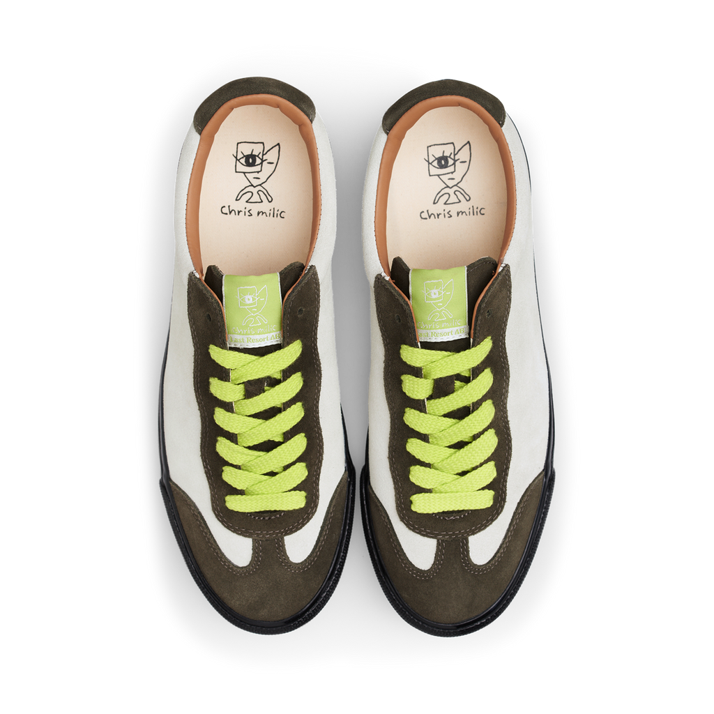 A pair of white and green Last Resort AB VM004 Milic Olive / Cream / Black sneakers with neon laces.