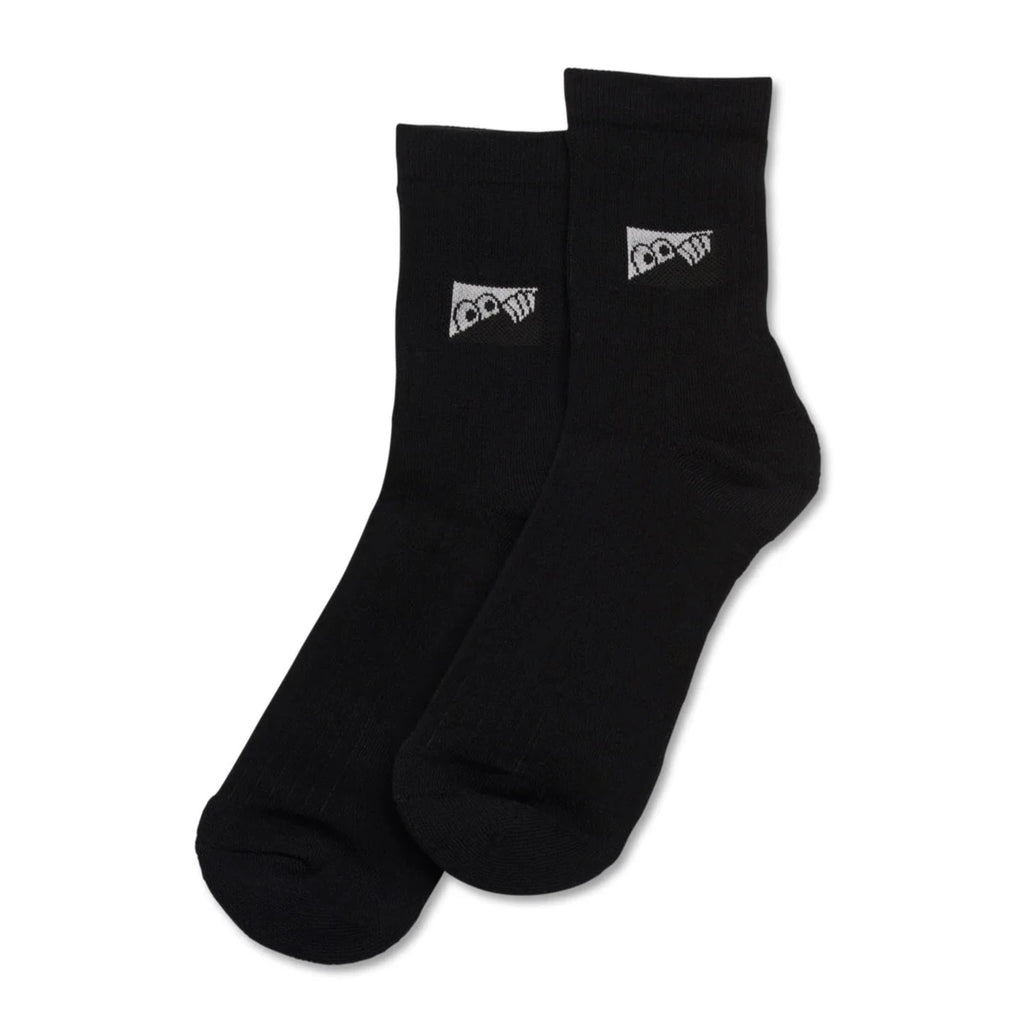 A pair of Last Resort heel tab dress socks black with a flag heel tab on them.