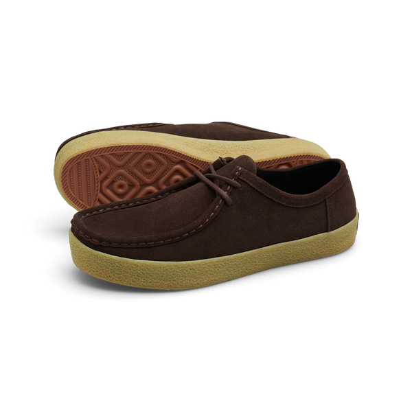 Introducing the LAST RESORT AB VM006 MOC BROWN / GUM by Last Resort AB: These moccasin-style shoes feature a brown suede upper with decorative stitching, complemented by light brown rubber soles and equipped with a Cloudy Cush insole for enhanced comfort.