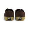 A rear view of the LAST RESORT AB VM006 MOC BROWN / GUM sneakers by Last Resort AB, showcasing brown suede with a beige rubber sole and a logo on the heel.