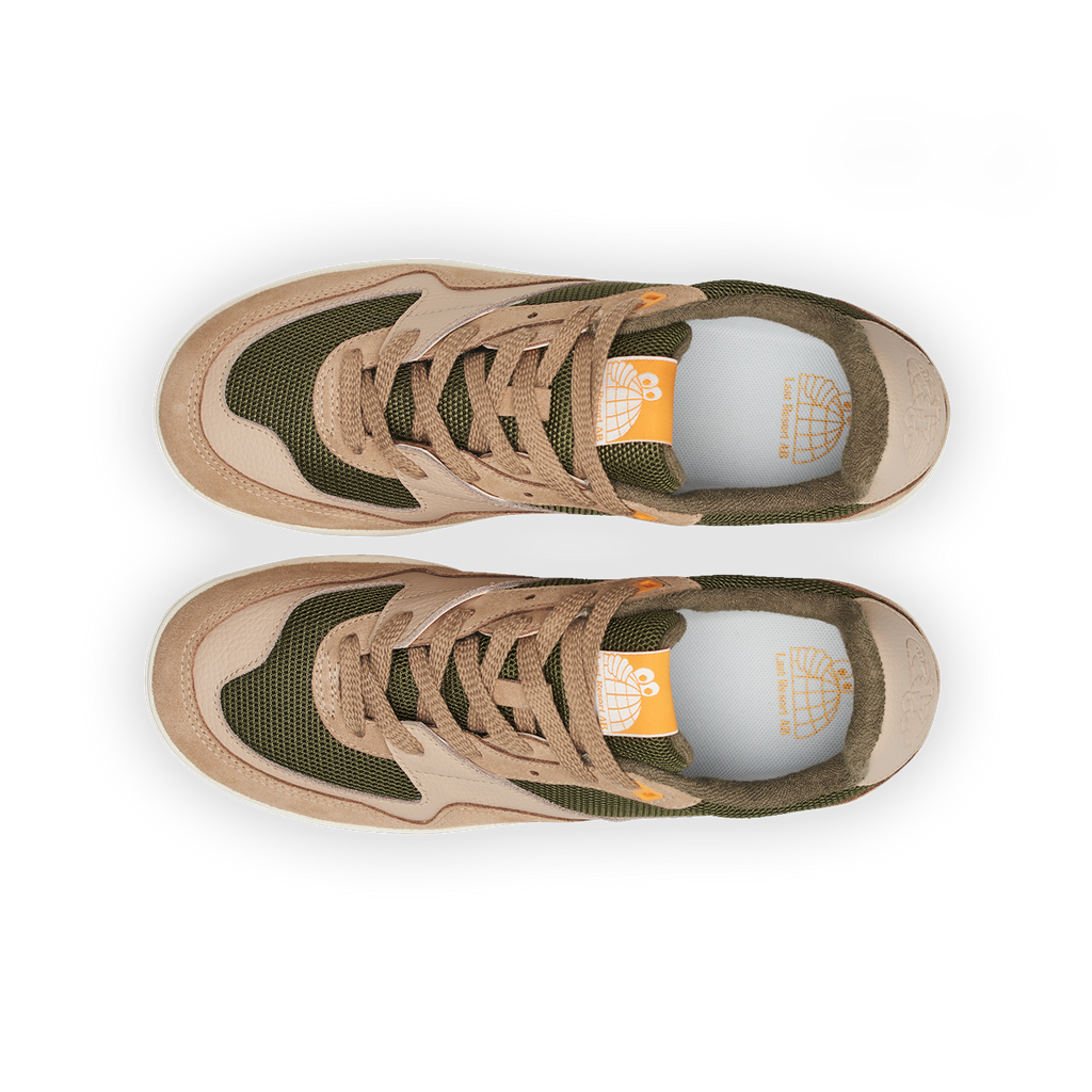 Top view of the LAST RESORT AB CM002 TACTILE GREEN sneakers featuring a blend of beige and green with mesh panels, orange details, and black suede accents, highlighting Last Resort AB's distinctive style.