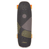 A top view of a LOADED BALLONA WILLY 27.75" COMPLETE mini cruiser skateboard with black grip tape featuring yellow and gray geometric patterns. The board, ideal for urban commuting, is equipped with orange wheels, and the "Loaded" brand name is visible near the tail.