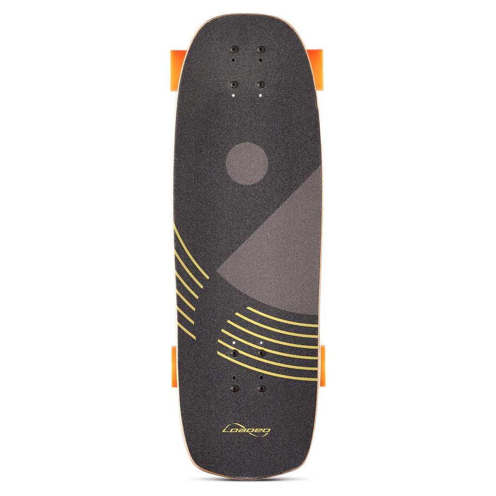 A top view of a LOADED BALLONA WILLY 27.75" COMPLETE mini cruiser skateboard with black grip tape featuring yellow and gray geometric patterns. The board, ideal for urban commuting, is equipped with orange wheels, and the "Loaded" brand name is visible near the tail.