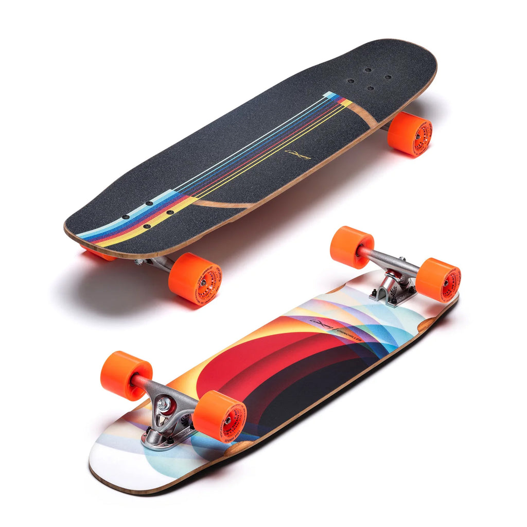 Two skateboards are displayed, one showing the black griptape side with colorful stripes, and the other featuring the vibrant geometric design of a LOADED CHINCHILLER 34" COMPLETE mini longboard with orange wheels, perfect for urban commuting.