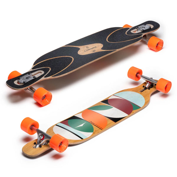 Two longboards: one displayed top-side up with grip tape, and the other bottom-side up showcasing a colorful geometric design. Both have bright orange wheels. Perfect for freestyle and freeride enthusiasts, these boards are reminiscent of the LOADED DERVISH SAMA FLEX 2 42.8" COMPLETE in both style and performance by Loaded.