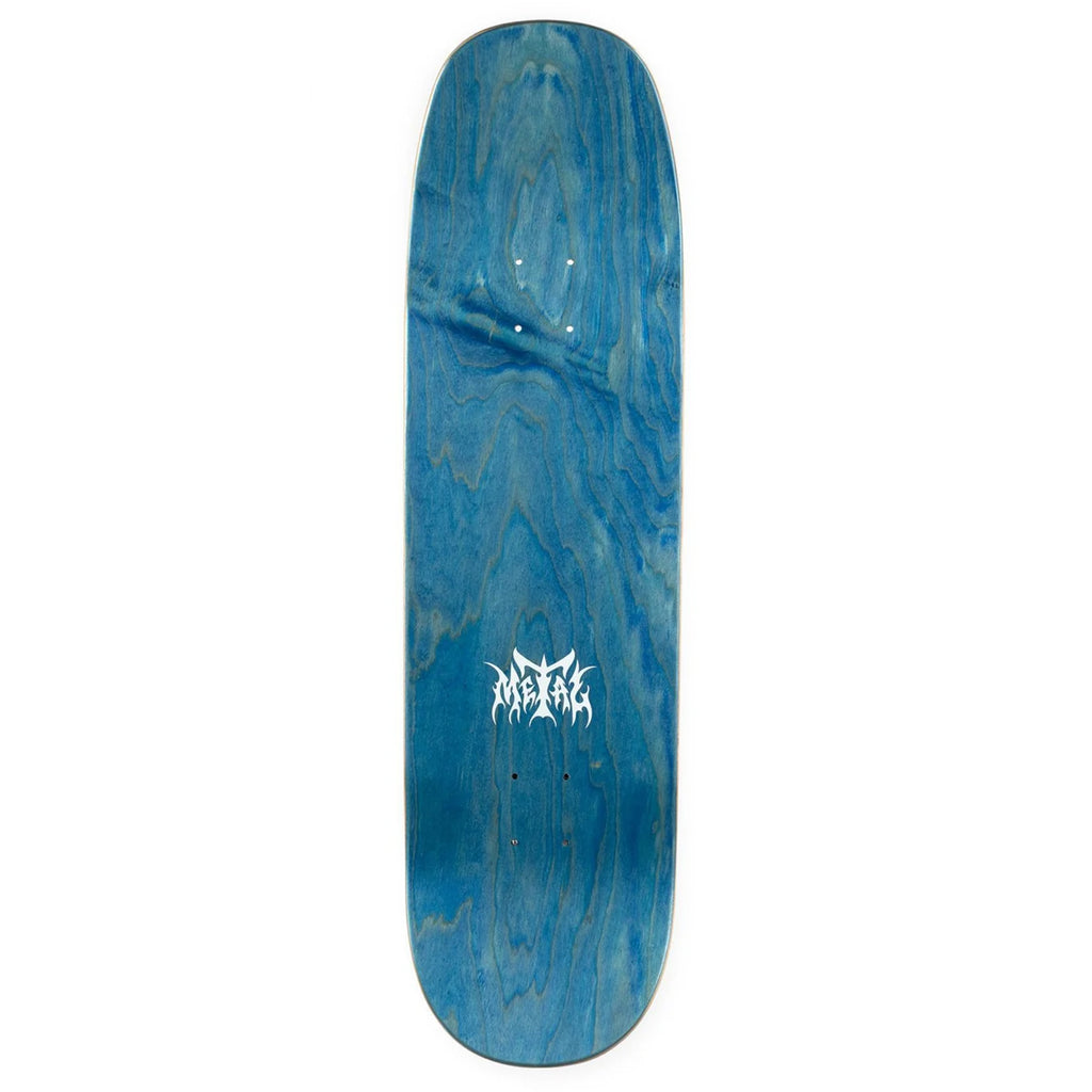 The blue stained top of a skateboard deck with the metal logo printed in white.