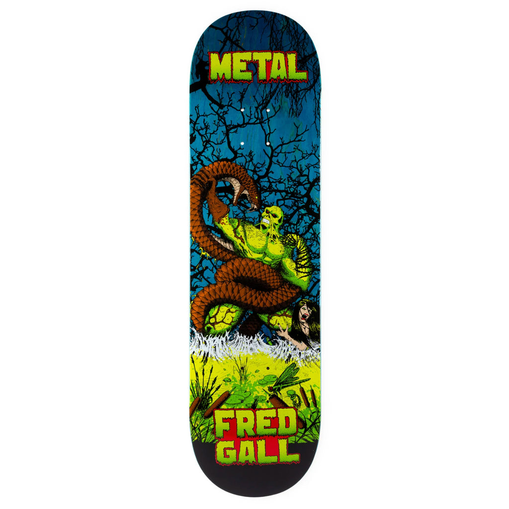 A METAL skateboard with a picture of a creature on it named METAL GALL SWAMP THING.