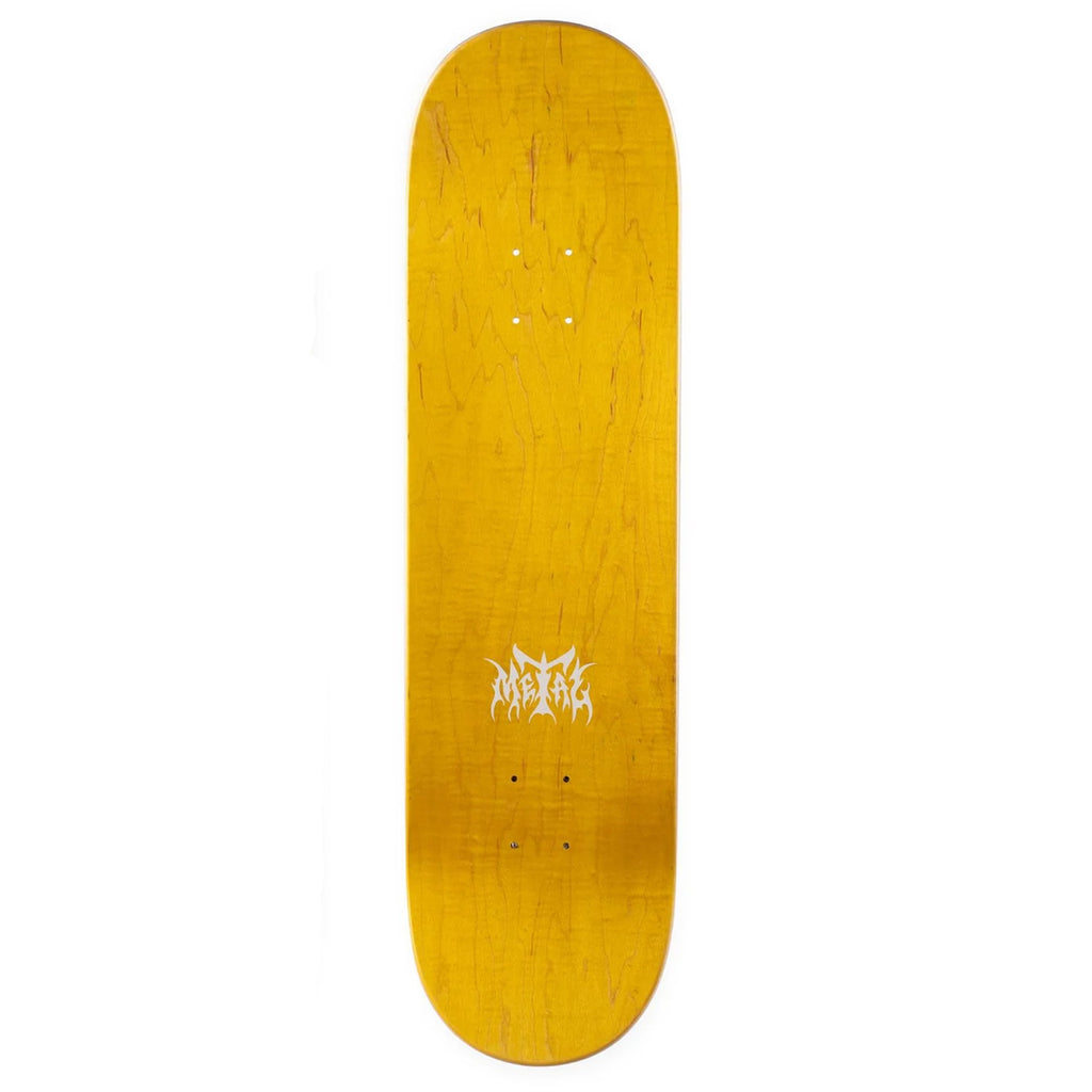 The top of a yellow skateboard deck with the metal logo in white.