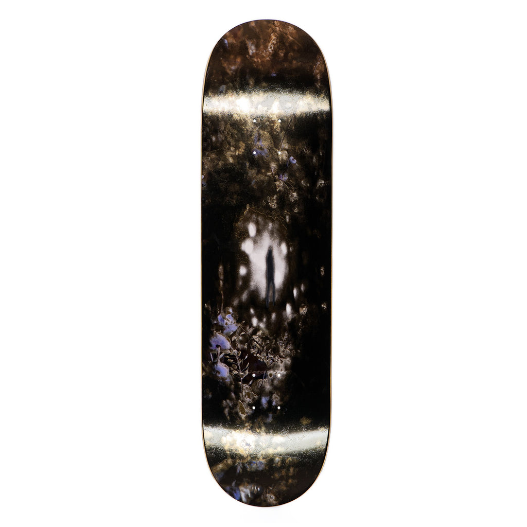 A LIMOSINE REPTILIAN skateboard with a black and white image on it.